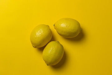 yellow lemons in a yellow background