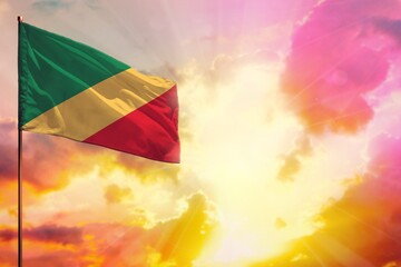 Fluttering Congo flag in top left corner mockup with the space for your text on beautiful colorful sunset or sunrise background.