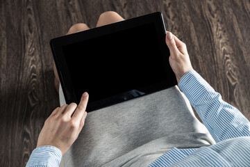 business woman with tablet on her lap