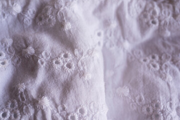 folded white napkin with lace top view