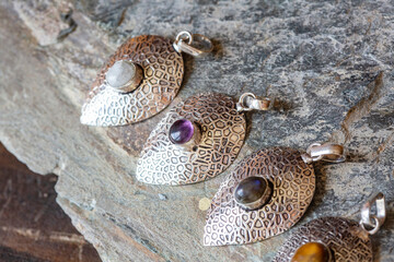 Silver metal pendant in natural shape with mineral stone decoration