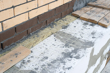 house made of foam concrete insulated with mineral wool and lined with bricks
