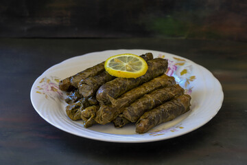 grape leaves, stuffed grape leaves, traditional food, dolmalar, sarmale, stuffed, lemon slices, appetizer