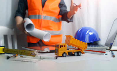 Fototapeta premium architect man working with blueprints,engineer inspection in workplace for architectural plan,sketching a construction project ,selective focus.