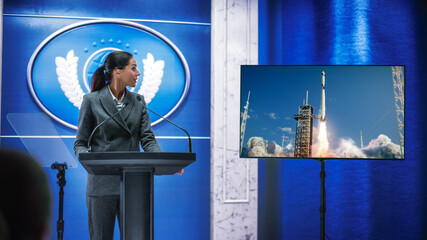 Organization Female Representative Speaking at Press Conference in Government Building about New Successful Space Rocket Lunch. Press Officer Delivering a Speech at Summit.