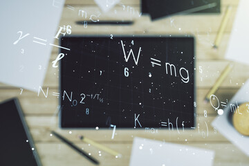 Creative scientific formula illustration and modern digital tablet on desktop on background, top...