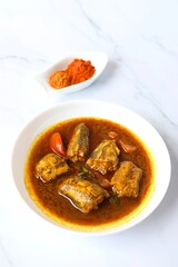 Indian Food - Homemade Spicy and tangy Bombay duck fish curry. Maharashtrian famous Bombil fish curry or Kalvan. Copy space.