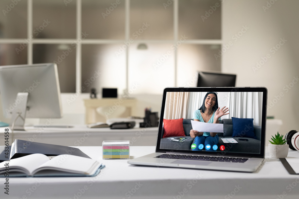 Sticker Laptop computer with a video call from businesswoman lying on desk