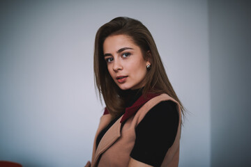 Fototapeta premium Calm woman with long hair in light room