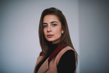 Fototapeta premium Young wistful female looking at camera