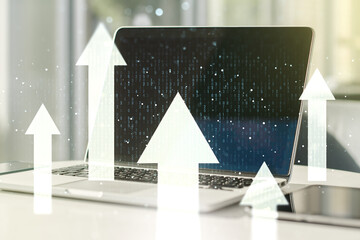 Double exposure of creative abstract upward arrows hologram on laptop background. Ambition and challenge concept