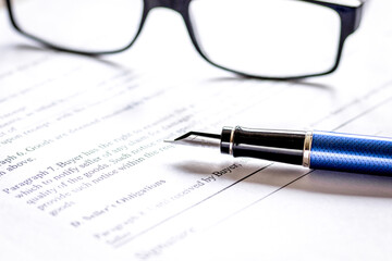 businessman office desk with contract for signig, glasses and pen