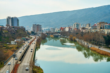 The Kura River flows through the city of Tbilisi. City landscape © Kate