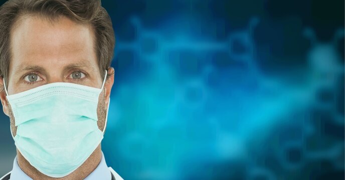 Portrait of caucasian male doctor wearing face mask against chemical structures on blue background