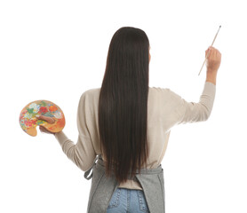 Young woman drawing with brush on white background, back view