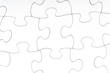Red jigsaw puzzle pieces on red background. Copy space and business concept