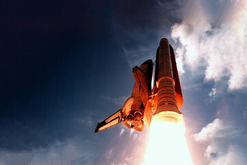Rocket launch from below, into the sky. Elements of this image were furnished by NASA.