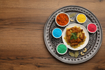 Traditional Indian food and color powders on wooden table, top view with space for text. Holi festival celebration