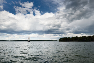 An elegant two-masted gaff schooner (tall ship, sailboat) sailing in Mälaren lake, Sweden. Travel,...