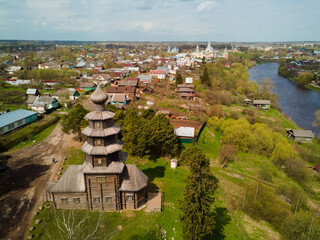 view from the drone to the old wooden church and the panorama of the city of Torzhok and the river. Tver Region Russia