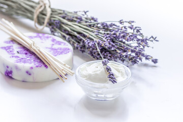 natural herb cosmetic with lavender flowers flatlay on white background