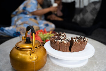 Dessert table with fruit, cake and hot beverage