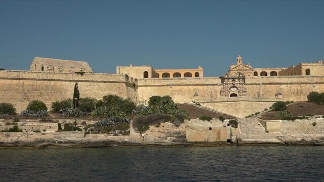 sailing close to the malta walls and shoreline.