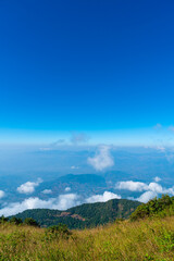 Fototapeta na wymiar beautiful mountain layer with clouds and blue sky