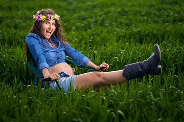 Pregnant woman in a wheat field