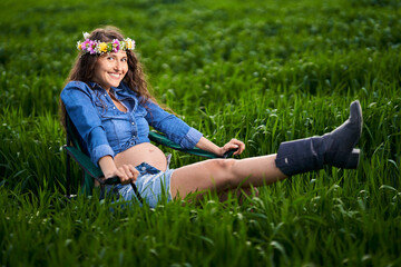 Pregnant woman in a wheat field