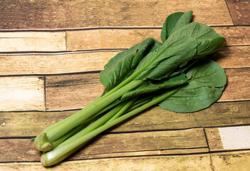 Bok choy on wooden floor, Bok choy or Chinese-cabbage on wooden board and wooden floor.Bok choy is the best leafy green vegetable.
