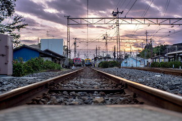 Fototapeta na wymiar Sunset seen from the railroad tracks. Fantastic landscape. In Japan, it is called 