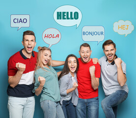 Happy people and illustration of speech bubbles with word Hello written in different languages on light blue background © New Africa