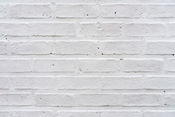 Rustic white painted brick wall texture background.