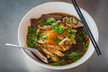 Top view Duck noodle on a white bowl,One of the menu of Thai street street noodles