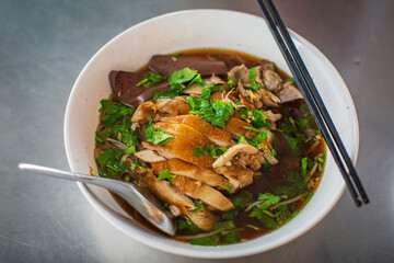 Top view Duck noodle on a white bowl,One of the menu of Thai street street noodles