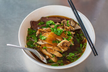 Top view Duck noodle on a white bowl,One of the menu of Thai street street noodles