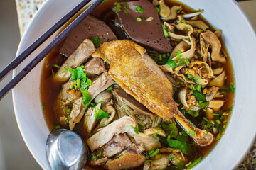 Top view Duck noodle on a white bowl,One of the menu of Thai street street noodles