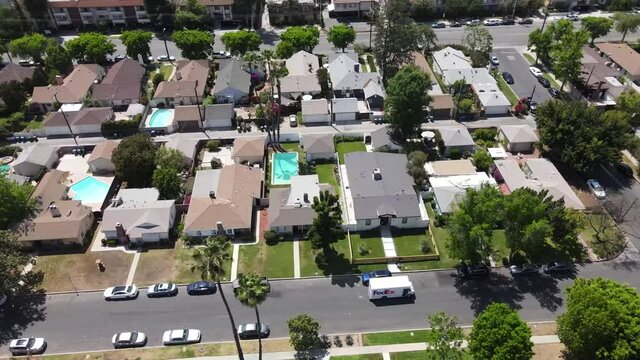 FedEx delivery van, delivering package to home in Sherman Oaks, Van Nuys house, aerial view