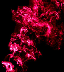 Red smoke isolated on black background.