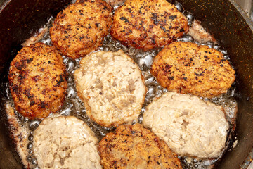 Minced meat cutlets are fried in oil