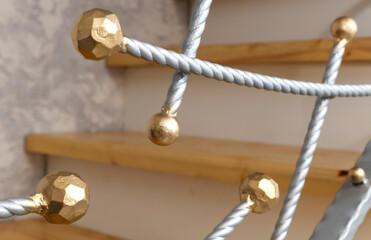 Gold-plated metal balls as decoration in the house. Close-up