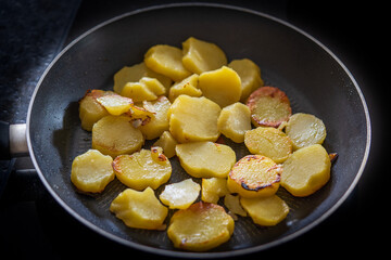 fried potatoes in a hot pan