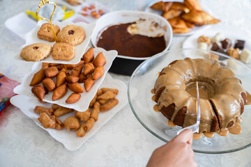 Eid dessert table with a selection of traditional snacks and cake