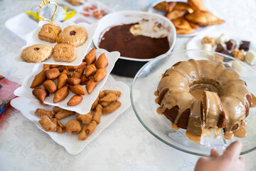 Eid dessert table with a selection of traditional snacks and cake