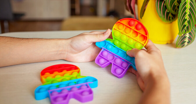 Young Man Playing With Fidget Sensory Toy To Relieve Stress, Simple Way To Be In Calm And Harmony, Mental Health Concept