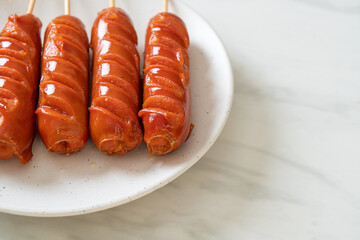 fried sausage skewer on plate