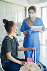Woman during a medical interview before a travel