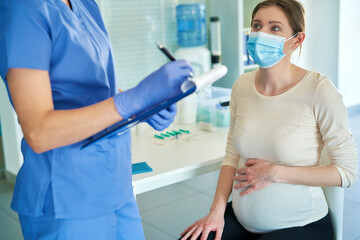 Pregnant woman during a medical interview