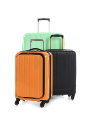 Modern suitcases for travelling on white background